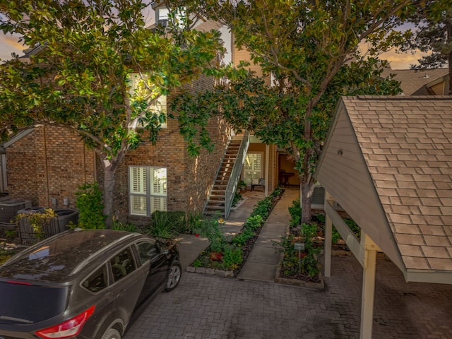 property exterior at dusk with central AC