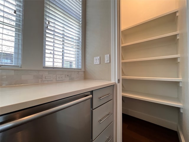 spacious closet featuring dark hardwood / wood-style flooring