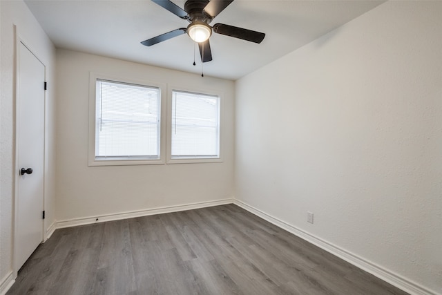 spare room featuring light hardwood / wood-style floors and ceiling fan