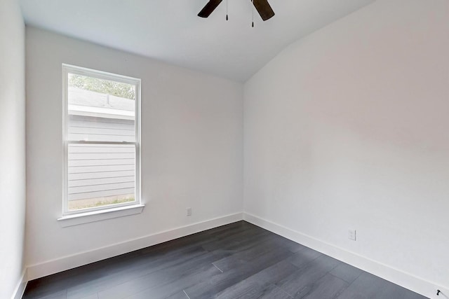 unfurnished room featuring a ceiling fan, lofted ceiling, dark wood-style flooring, and baseboards