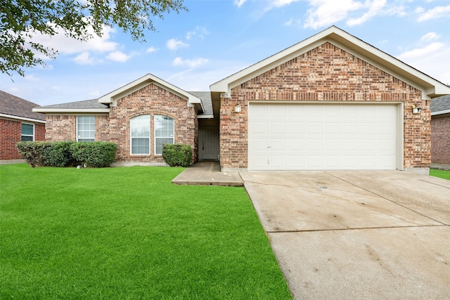 view of front of house with a front lawn and a garage