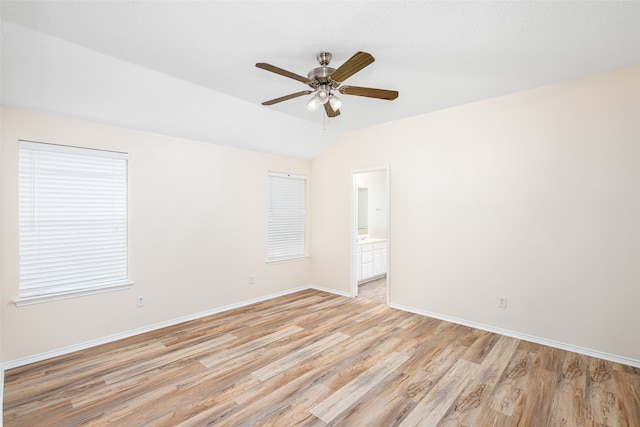 unfurnished room with vaulted ceiling, light hardwood / wood-style floors, and ceiling fan