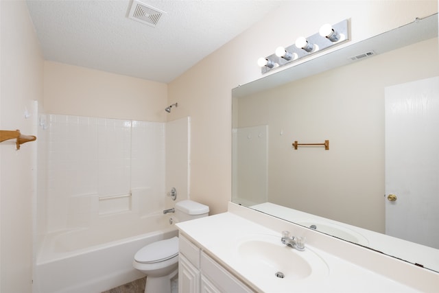 full bathroom featuring vanity, toilet, shower / bathing tub combination, and a textured ceiling