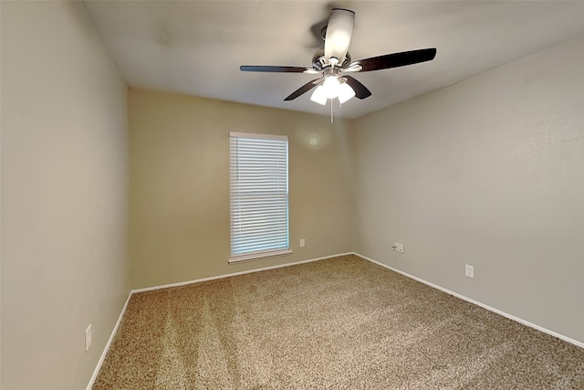 empty room featuring carpet and ceiling fan