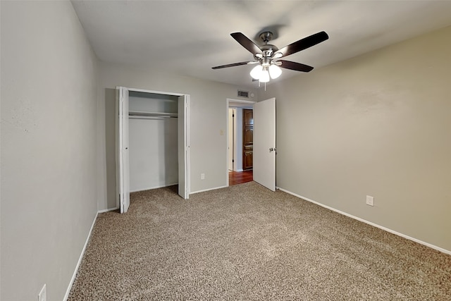 unfurnished bedroom featuring carpet flooring, a closet, and ceiling fan