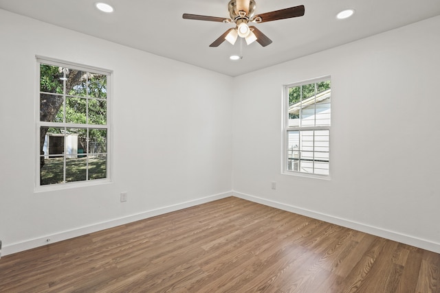 unfurnished room featuring hardwood / wood-style flooring and ceiling fan