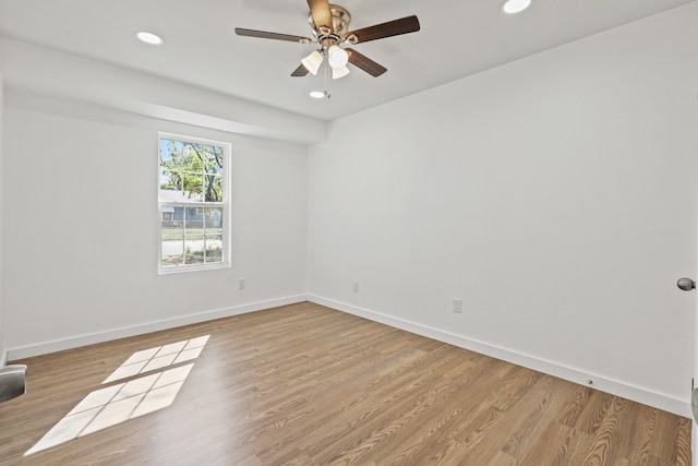 unfurnished room with light hardwood / wood-style floors and ceiling fan