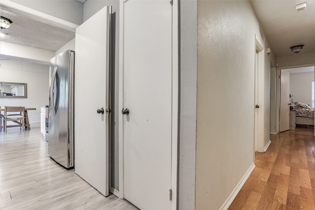 corridor featuring light wood-type flooring