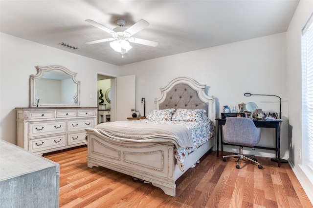 bedroom featuring light wood-type flooring and ceiling fan