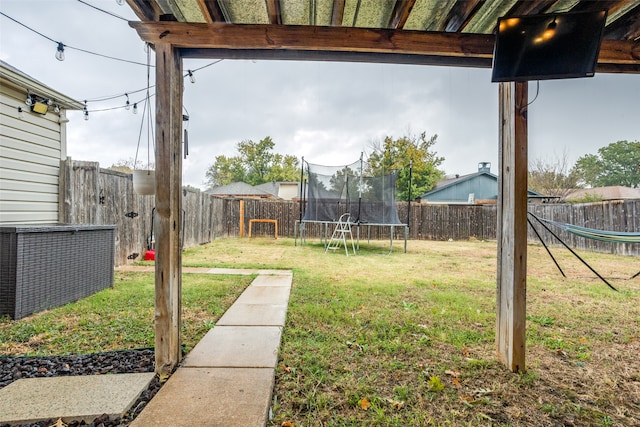 view of yard featuring a trampoline