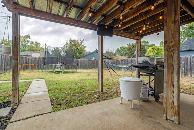 view of yard with a patio area and a trampoline