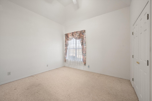 unfurnished bedroom with light colored carpet and ceiling fan