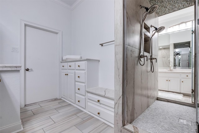 bathroom with crown molding and vanity