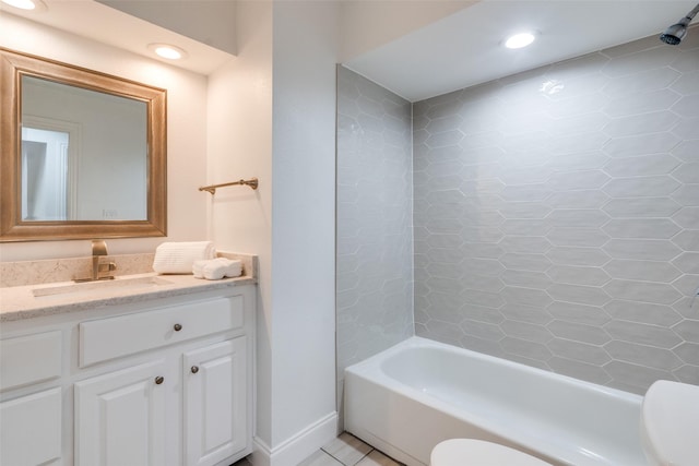 full bathroom with tile patterned flooring, vanity, toilet, and tiled shower / bath combo