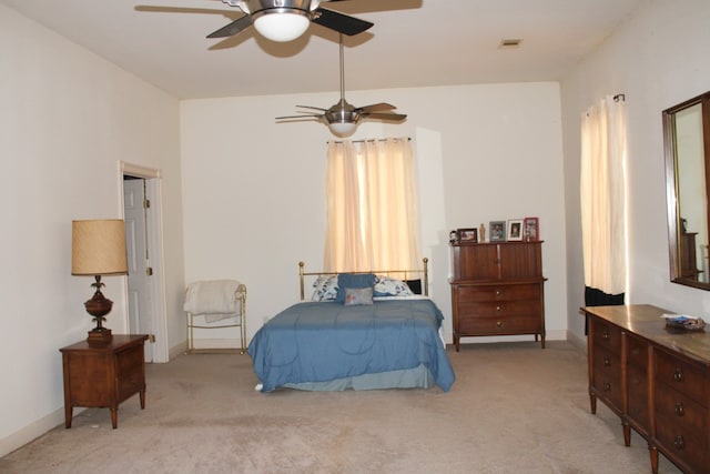 bedroom with light colored carpet and ceiling fan