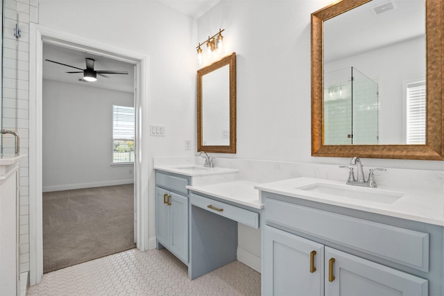 bathroom featuring ceiling fan, tile patterned floors, walk in shower, and vanity