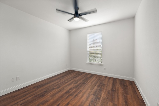 unfurnished room featuring dark hardwood / wood-style floors and ceiling fan