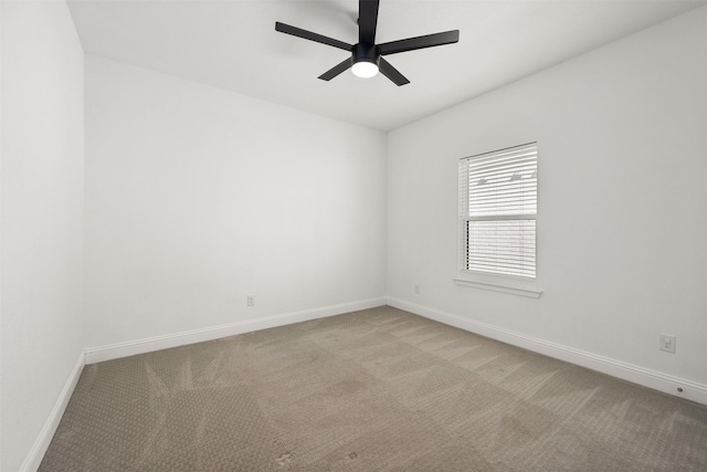 empty room with light carpet and ceiling fan