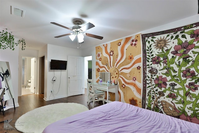 bedroom featuring ensuite bath, ceiling fan, and dark wood-type flooring