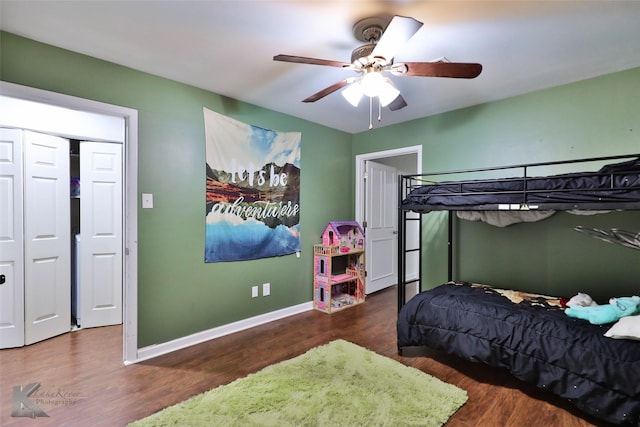 bedroom with ceiling fan and dark hardwood / wood-style flooring