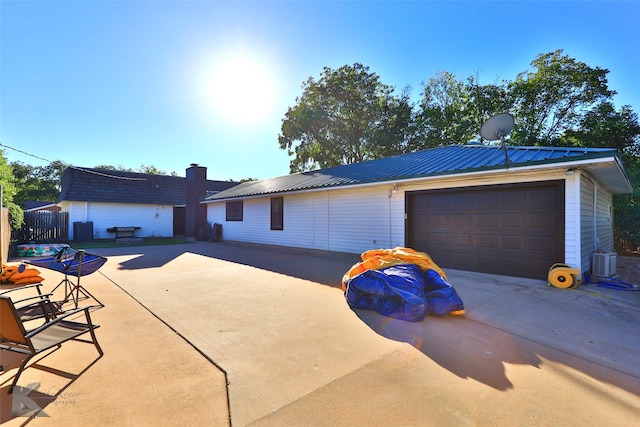 view of front of property with an outbuilding and a garage