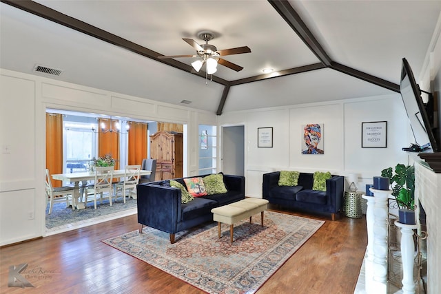 living room featuring a fireplace, ceiling fan, dark hardwood / wood-style flooring, and lofted ceiling with beams