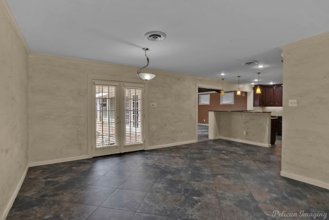 interior space featuring ornamental molding and french doors