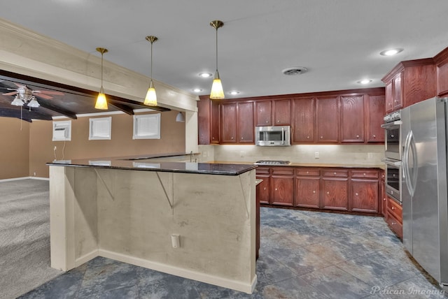 kitchen featuring decorative light fixtures, appliances with stainless steel finishes, kitchen peninsula, ceiling fan, and beam ceiling