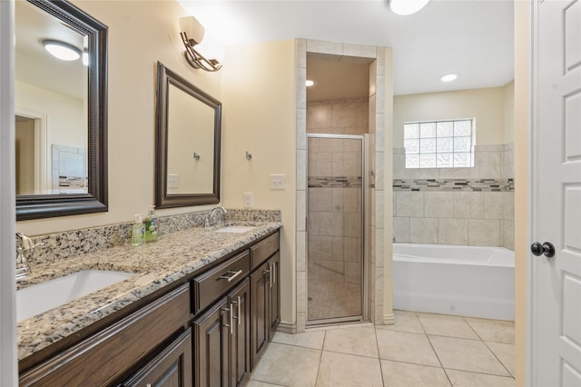 bathroom with plus walk in shower, vanity, and tile patterned floors