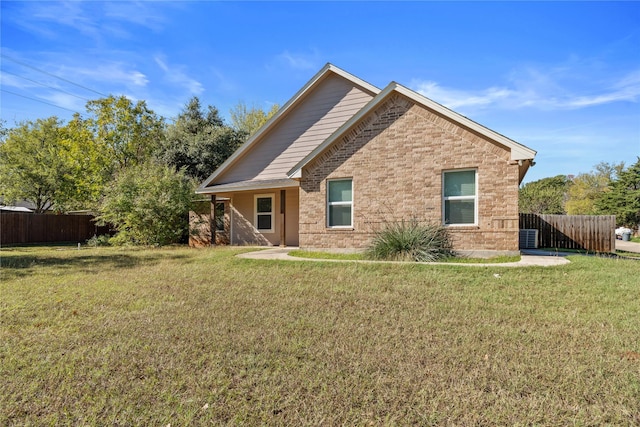 back of property featuring a lawn