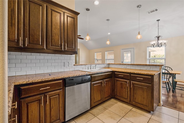 kitchen with pendant lighting, dishwasher, vaulted ceiling, tasteful backsplash, and kitchen peninsula