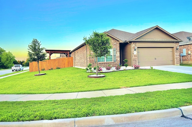 view of front of house with a garage and a yard