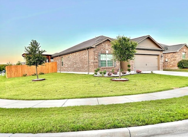 single story home with a lawn and a garage