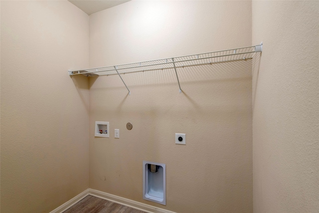 laundry area with gas dryer hookup, washer hookup, hookup for an electric dryer, and hardwood / wood-style flooring