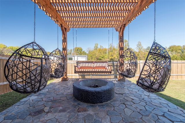 view of patio featuring an outdoor fire pit and a pergola