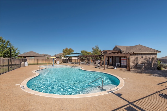 view of pool with a patio and a pergola