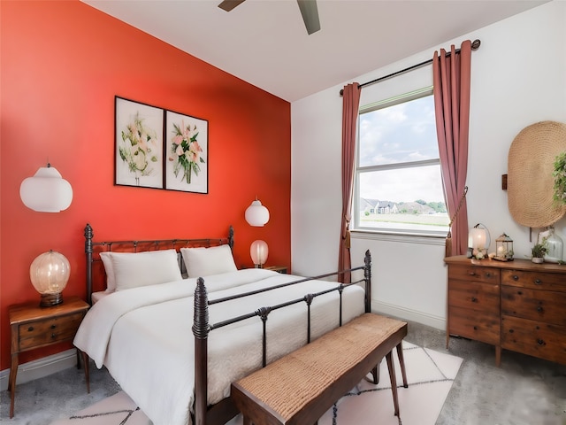 bedroom featuring ceiling fan and concrete flooring