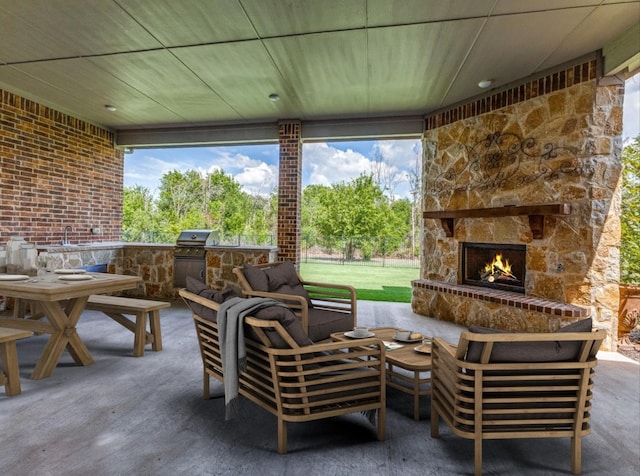 view of patio featuring an outdoor living space with a fireplace