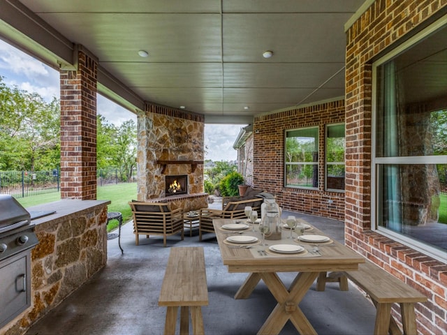 view of patio / terrace with an outdoor stone fireplace