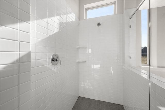 full bathroom with a tile shower