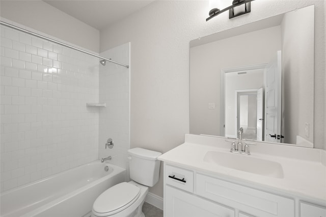 bathroom with toilet, washtub / shower combination, and vanity