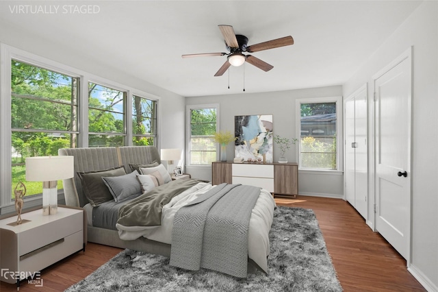 112 Pennsylvania Ave, Shreveport, LA 71105 - bedroom with a ceiling fan, wood finished floors, baseboards, and multiple windows