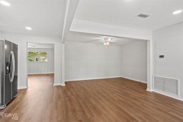 112 Pennsylvania Ave, Shreveport, LA 71105 - unfurnished living room featuring visible vents, baseboards, a ceiling fan, and dark wood-style floors