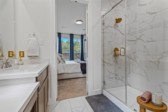 bathroom with vanity and a shower with shower door