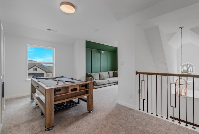 rec room with light colored carpet, billiards, and vaulted ceiling