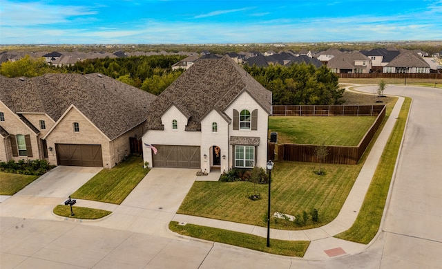 view of front facade with a front lawn and a garage