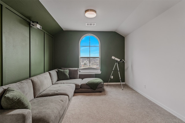 living room with lofted ceiling and carpet floors