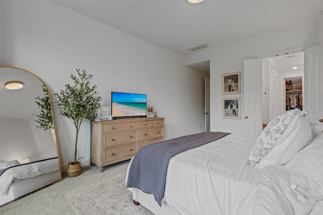 bedroom featuring light carpet