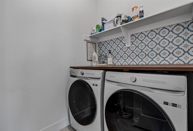 washroom with washing machine and dryer