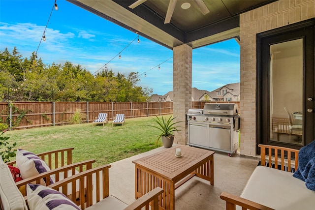 view of patio / terrace featuring ceiling fan and a grill